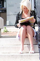 Sexy blonde with newspaper. Up skirt pics